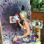 Calley working in one of her Four Seasons Hualalai Pop-Up Studio locations on the ‘Alala painting.  She always wondered what species would ever work on this wild painting!